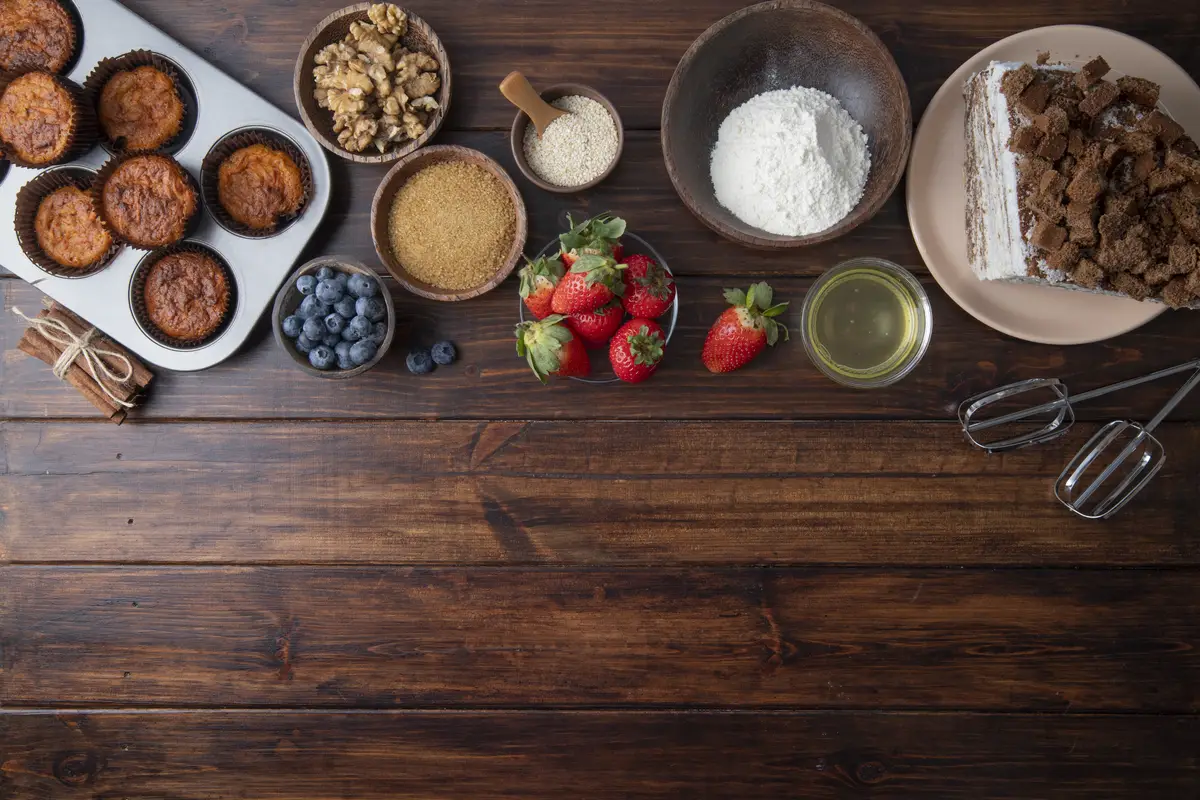 Flat lay delicious fruits and muffins