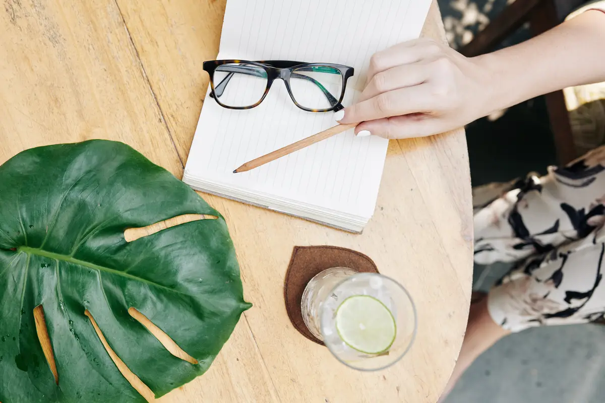 Woman writing in planner