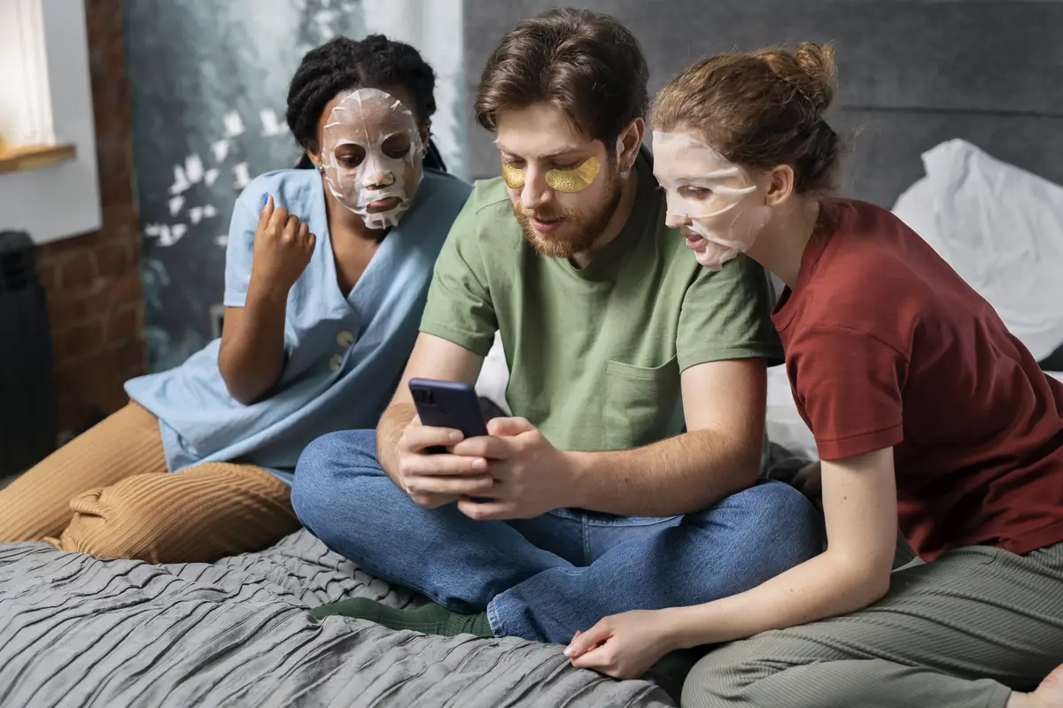 Roommates practicing skincare in bed