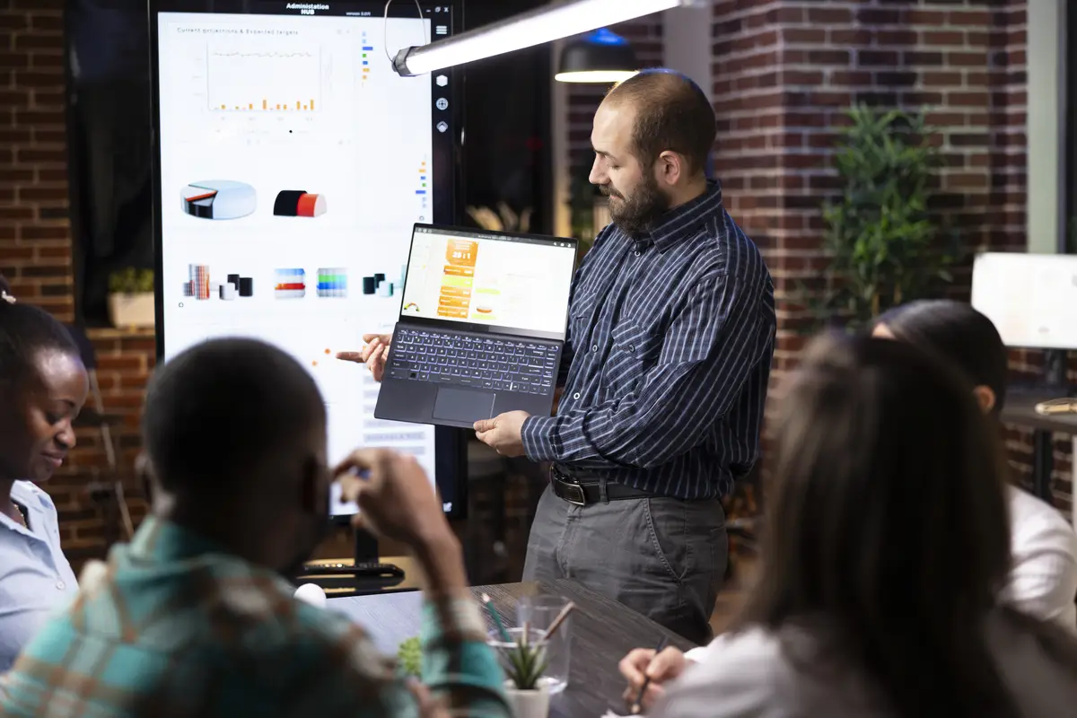 Male consultant presents business analytics