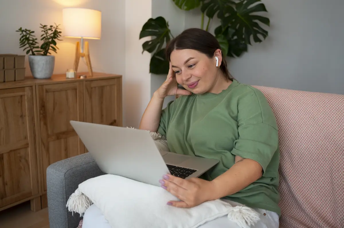 Woman having a video call at home on a laptop device