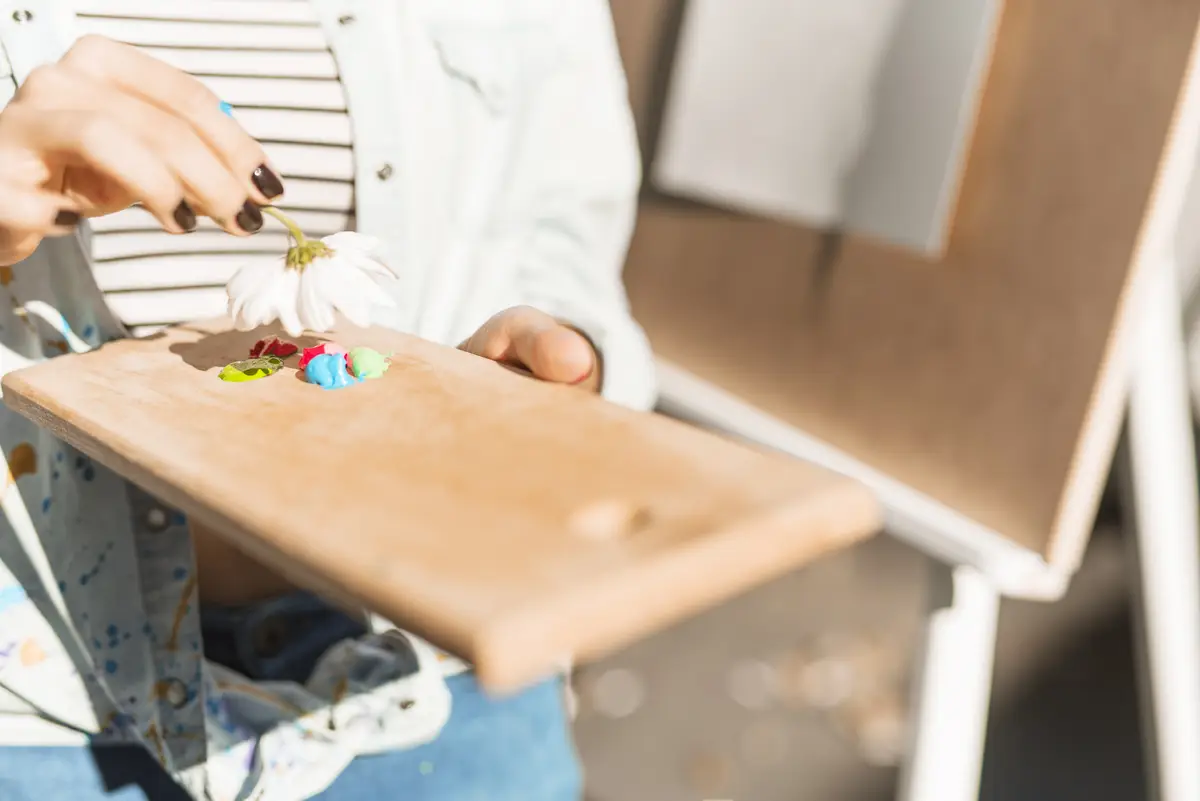 Girl with color palette outdoors