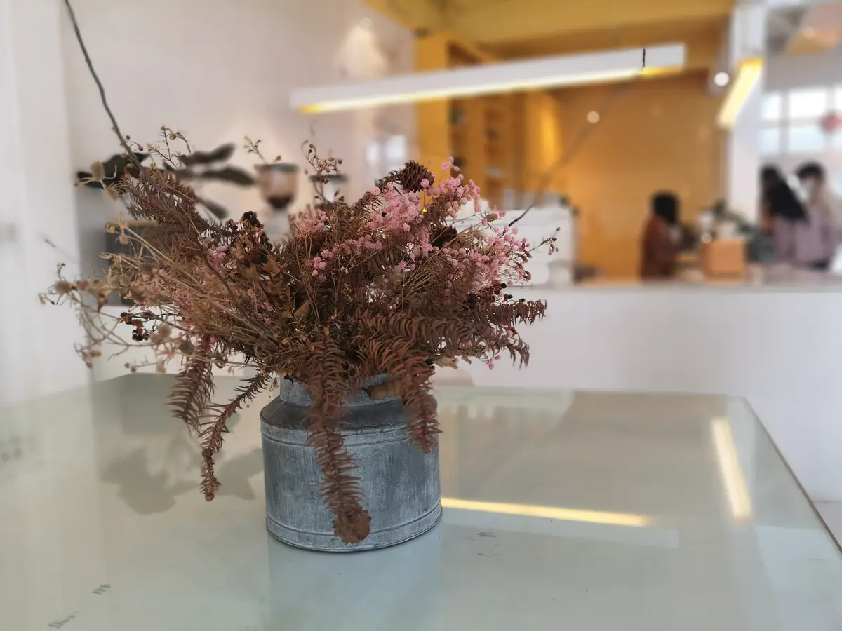 Close-up of flower vase on table at home