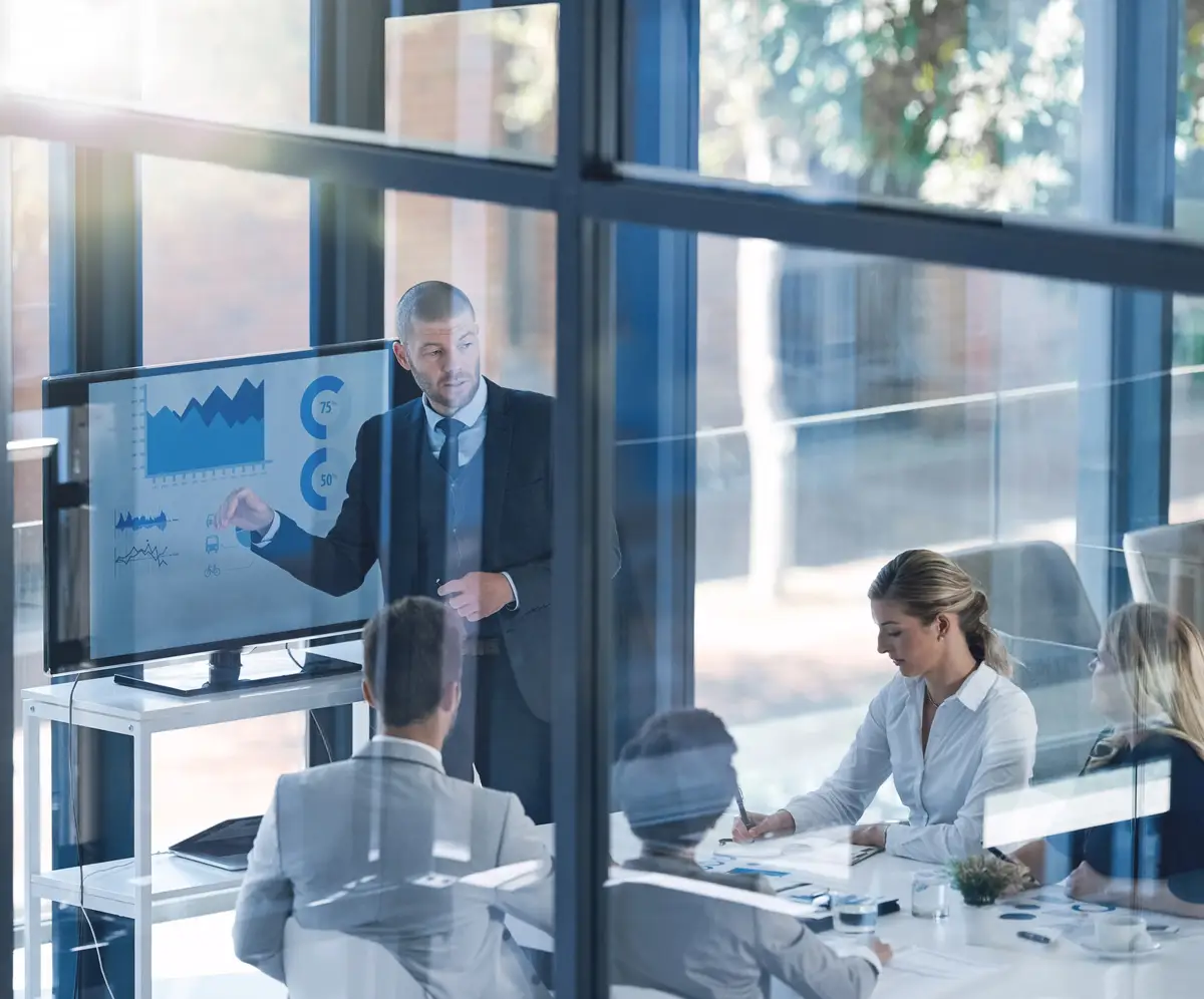 Business meeting people and budget review with screen for revenue charts and statistics for profit data analysis Speaker CFO and teamwork for accounting with fintech for results graphs and audit