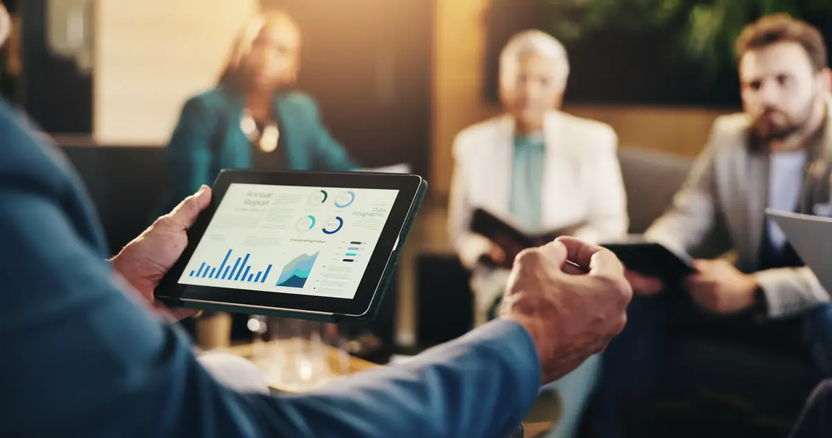 Business data hands and meeting with tablet screen for corporate revenue budget performance or stats analysis Closeup investors and graphs for financial forecasting sales discussion and feedback