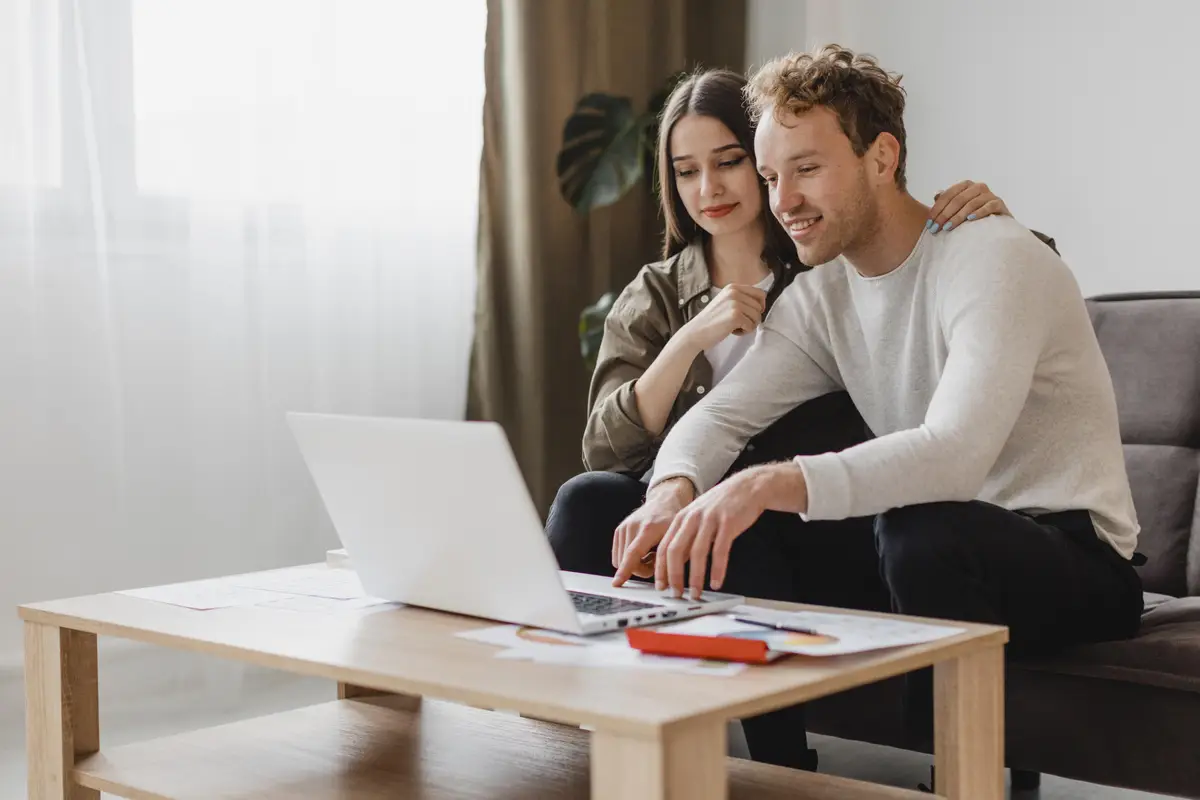 Front view of couple making plans to remodel the household together