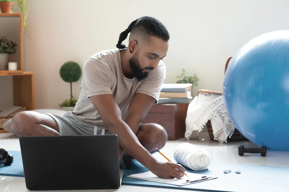 Full shot man writing with pencil