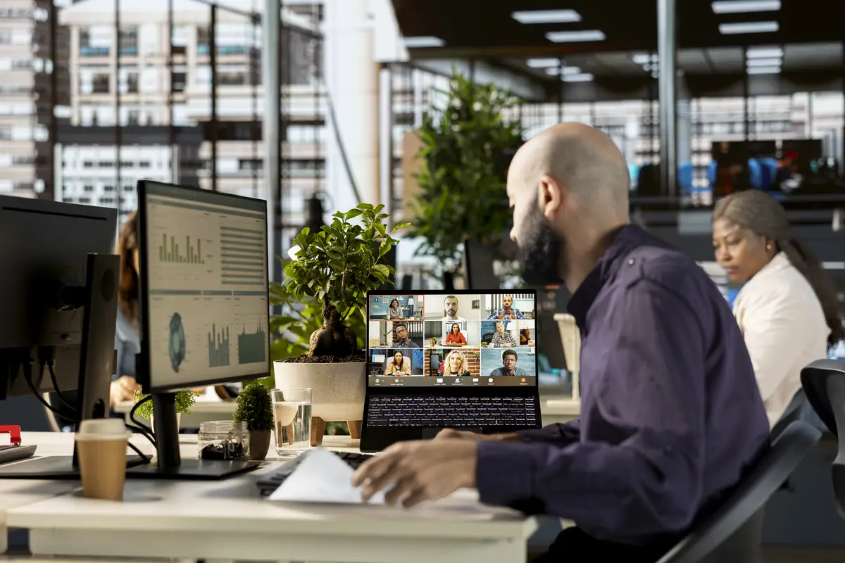 Middle eastern employee joins a video call with executive board members