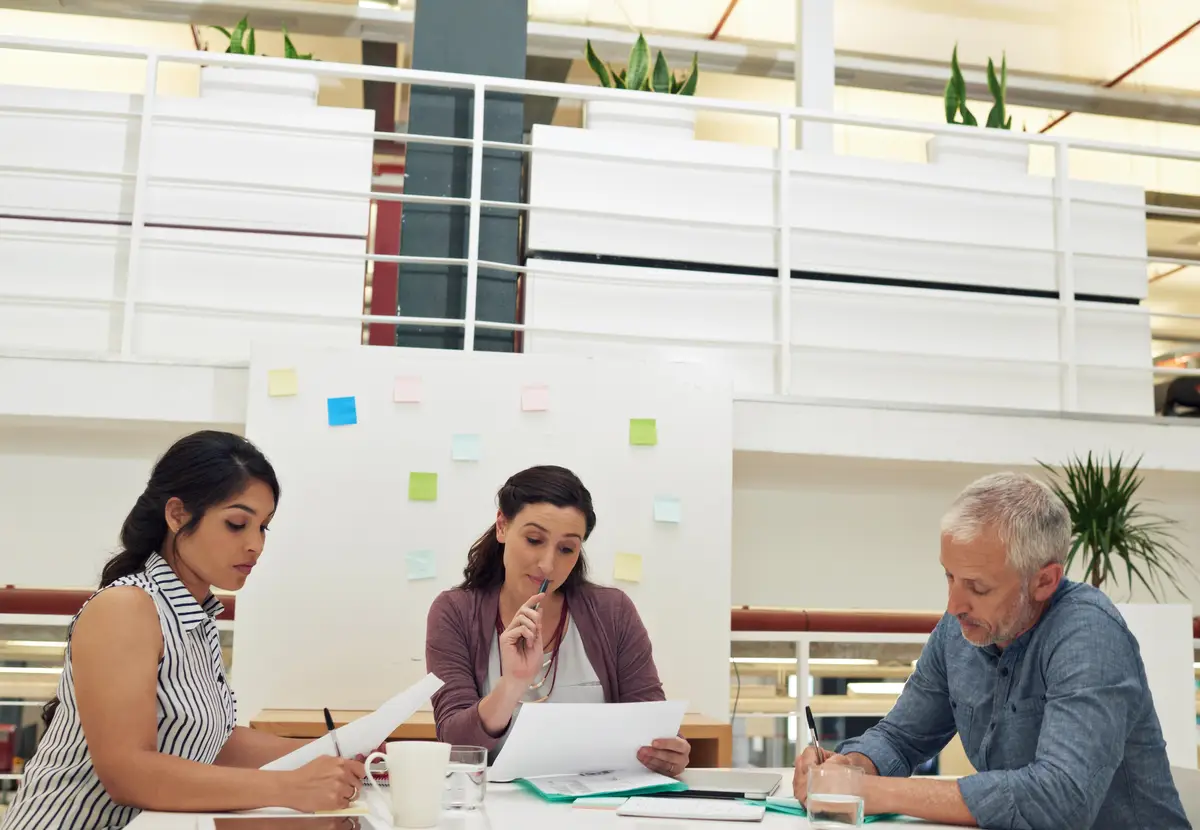 Focused on the essentials of their project Shot of a team of colleagues having a meeting in a modern office