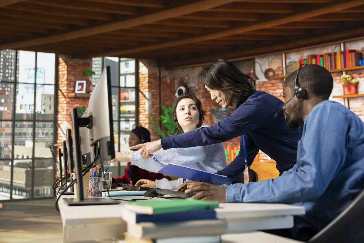 Call center manager evaluating multiethnic team performance