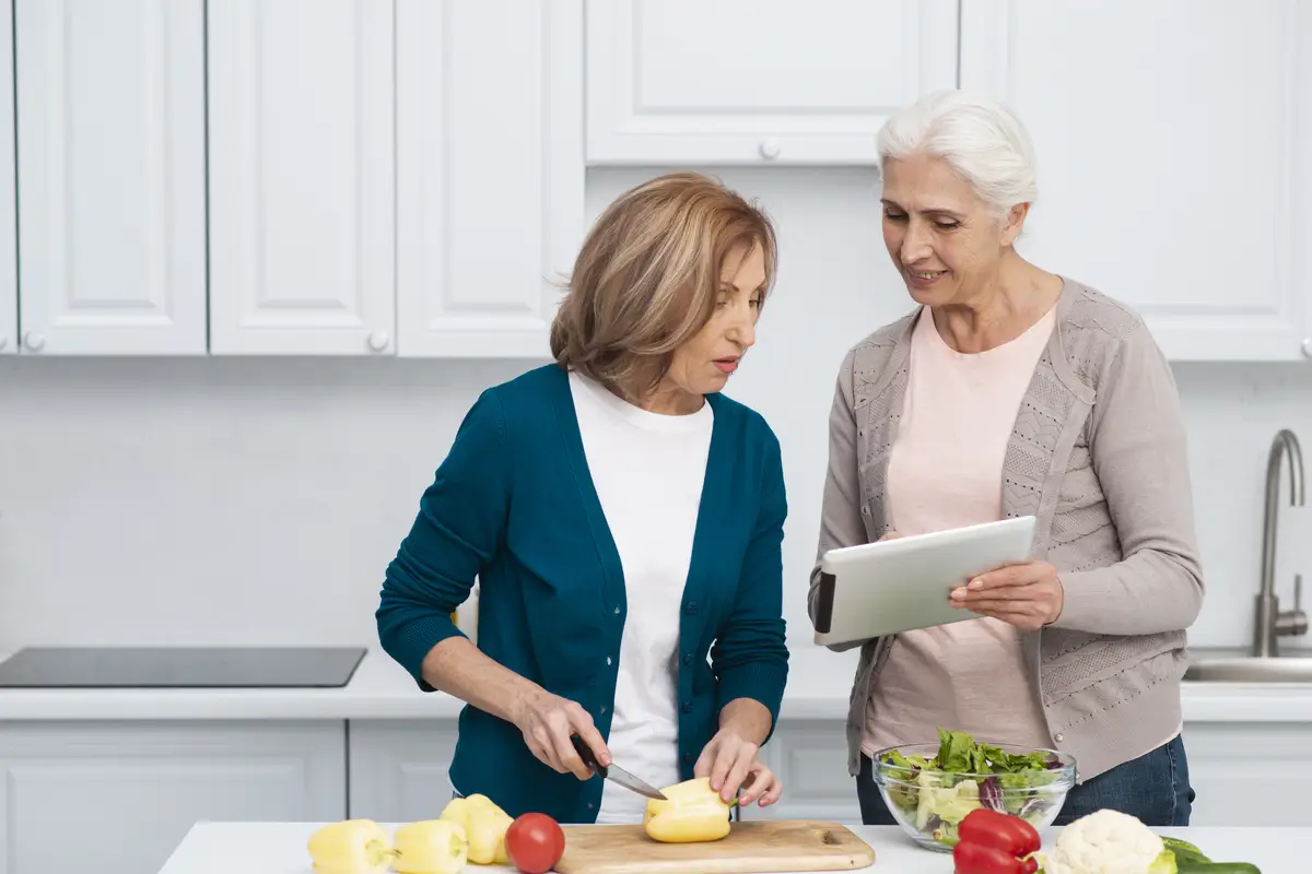 Front view women cooking together