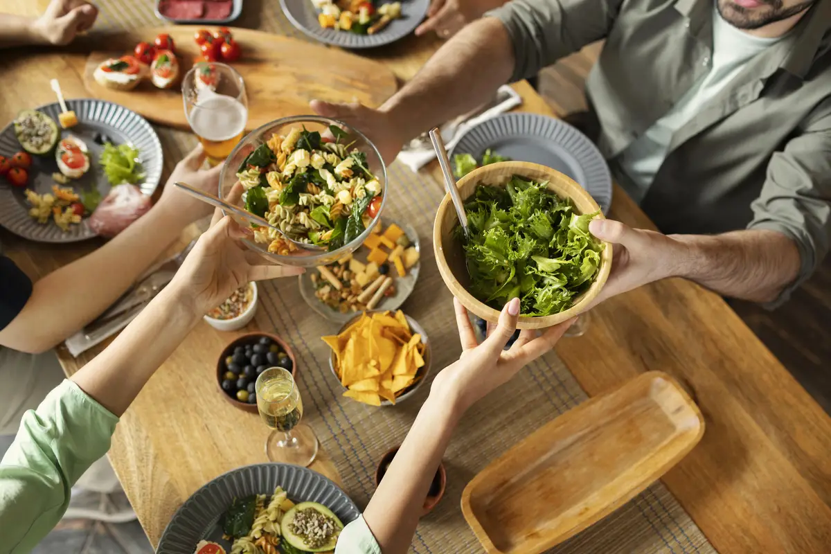 Close up friends with delicious salad