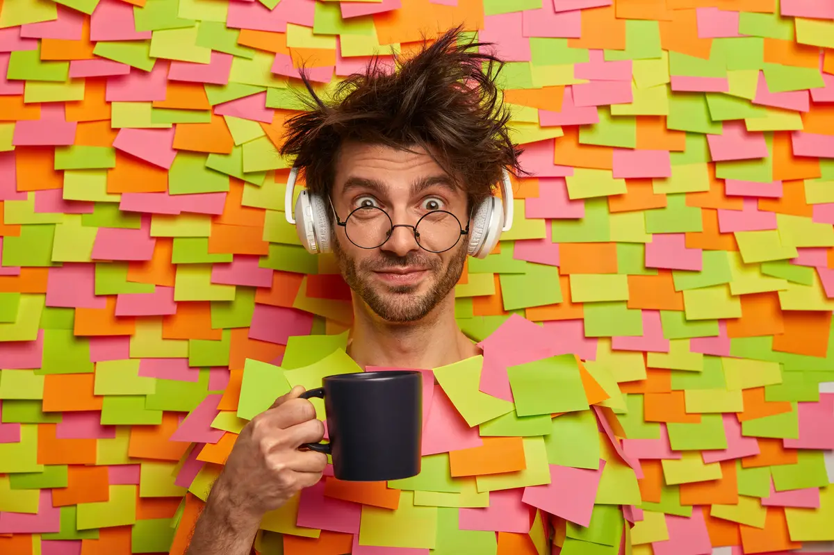 Close up on young student surrounded by sticky notes