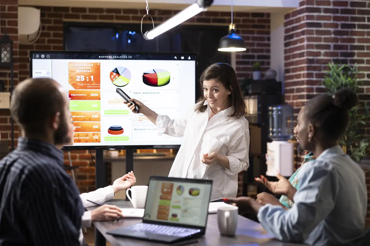 Businesswoman Presenting Strategies to Team