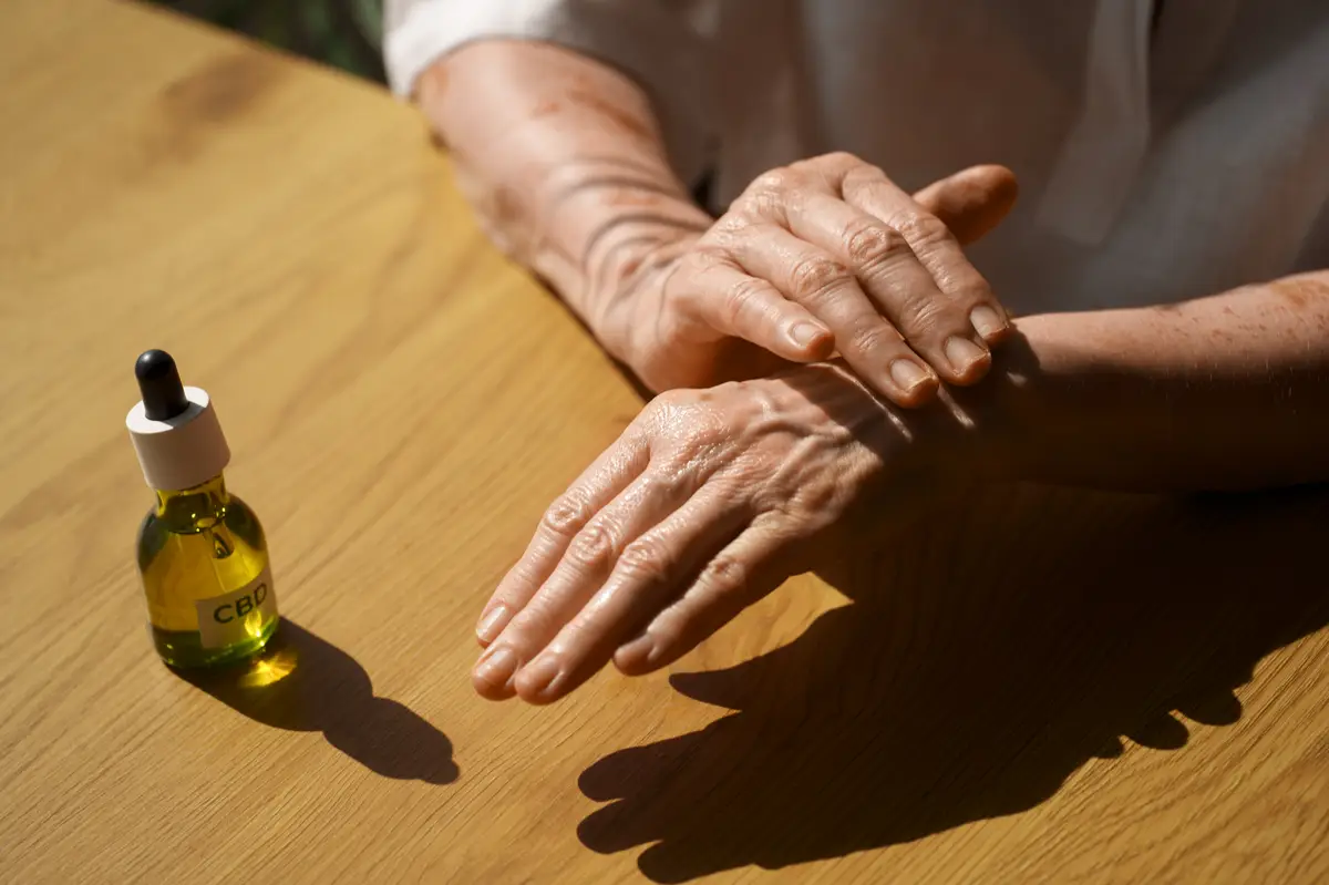 Close up on woman using cbd oil on hand