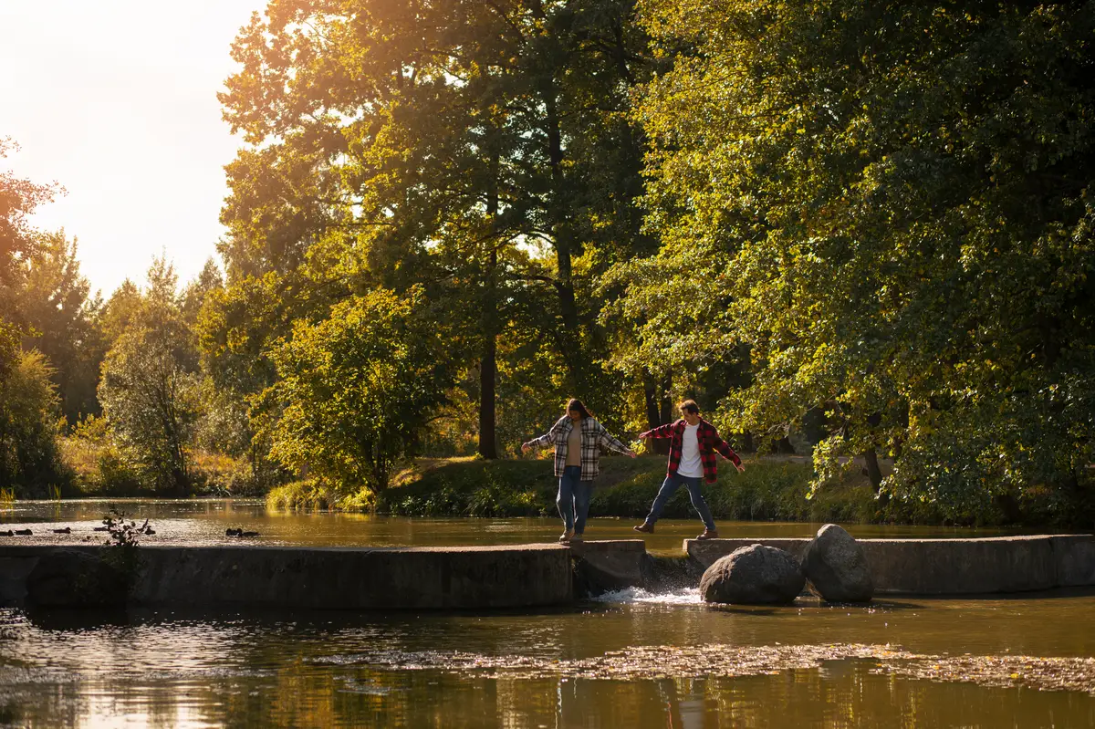 Cute couple walking in nature long shot