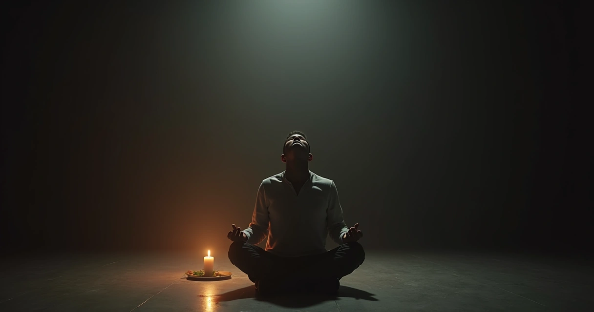 Person meditating by a candle during a ritual