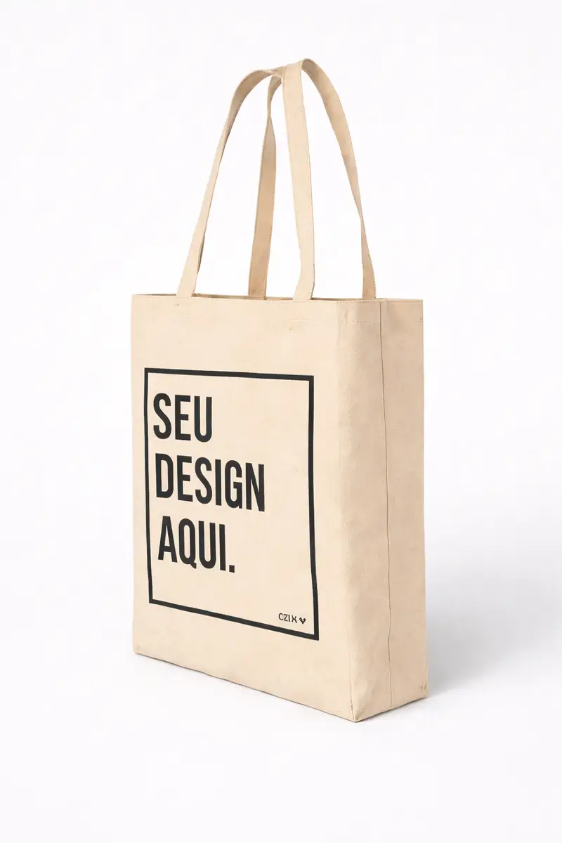 Ecobag bege com alças duplas e a frase 'SEU DESIGN AQUI.' impressa na frente em letras pretas