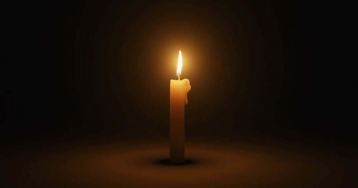 Vela acesa simbolizando homenagem e memória 